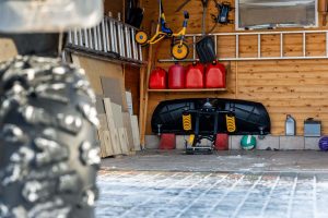 organized outdoor shed interior with shelving pegboard and labeled bins
