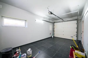 Small detached garage designed for hobby mechanic work with tools, storage, and workspace areas