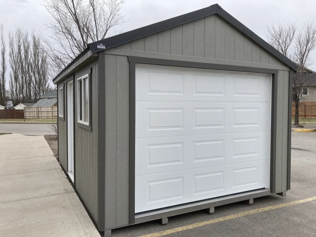 Custom prefab storage shed with garage door built by Fox Buildings in Lethbridge