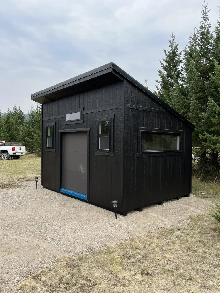 Modern single slope shed with black exterior built by Fox Buildings in Lethbridge