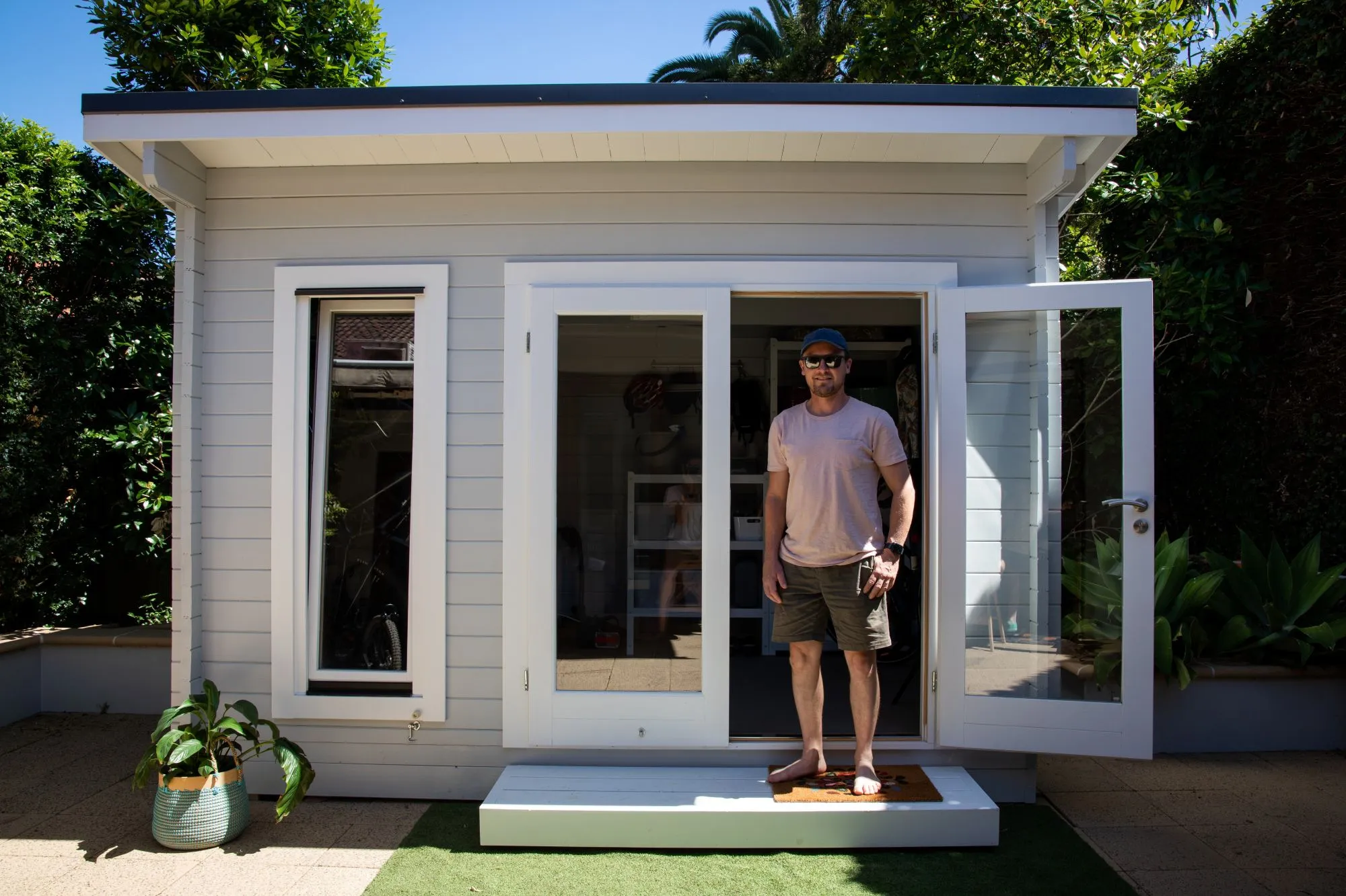 Custom backyard shed and detached garage comparison on a residential property in Lethbridge